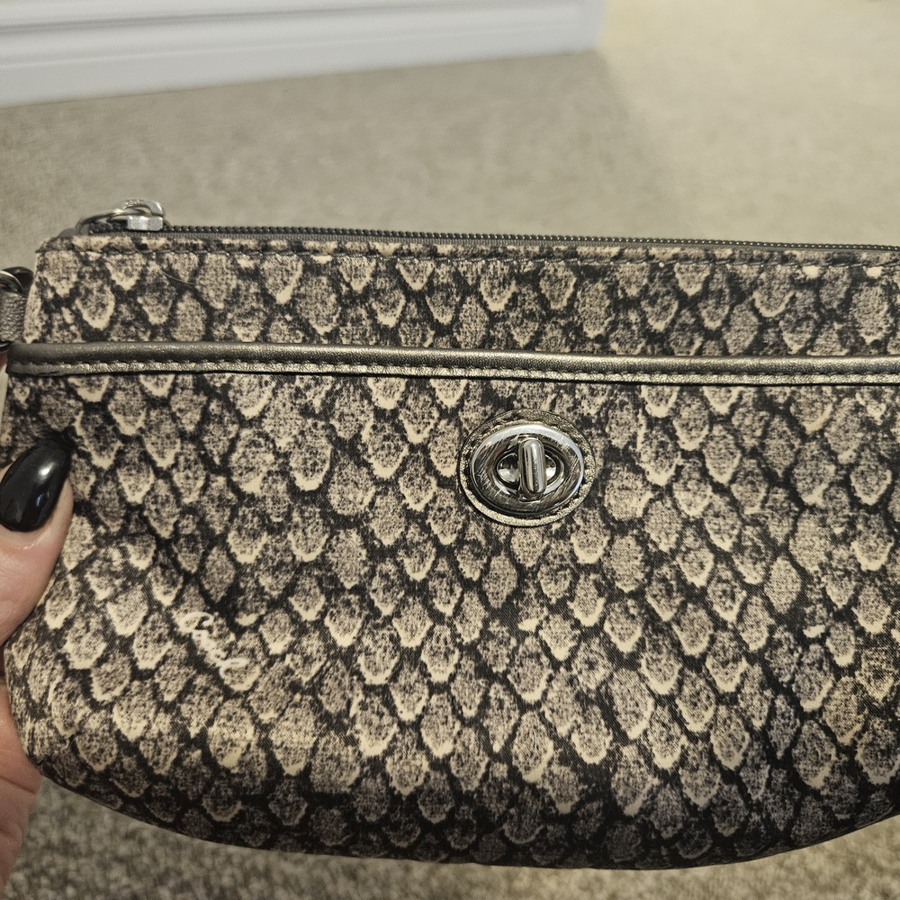 COACH-Black and Cream Clutch with Textured Design and Zipper Closure